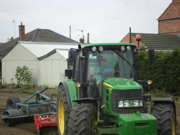 William driving Jamie's tractor