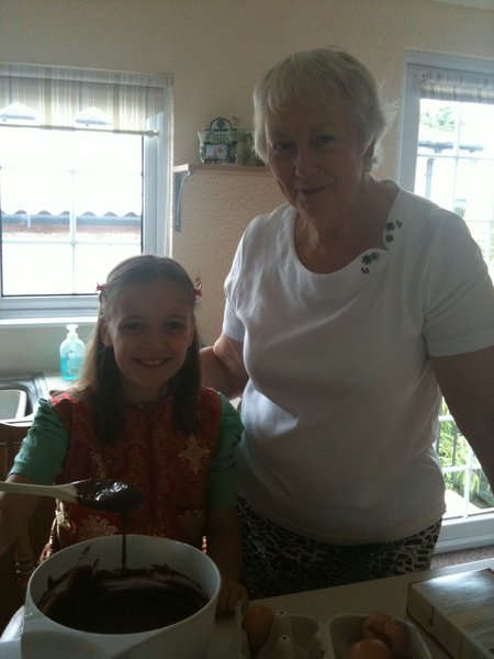 Nanny and Sophie making chocolate cake