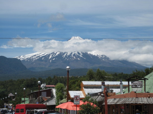 The town and volcano masked by clouds