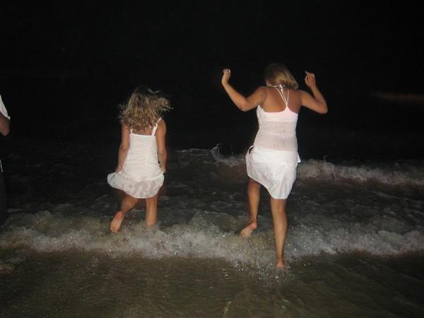 New Years Eve, girls jumping waves