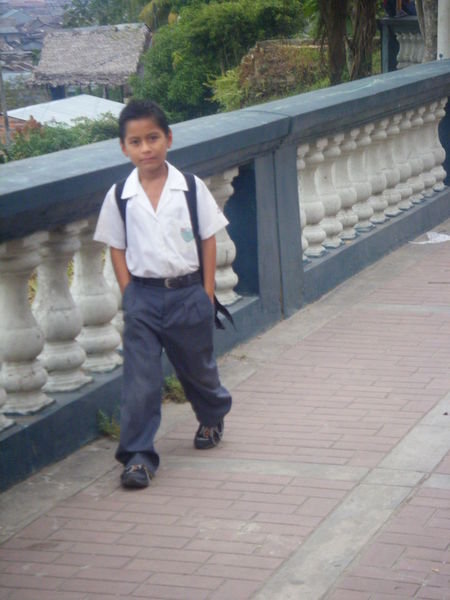 a boy walking to school early in the morning
