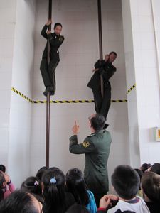 firemen showing us how to use the poles