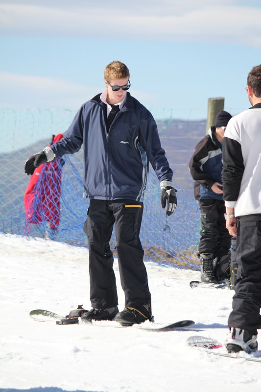 Tom practising on the snowboard