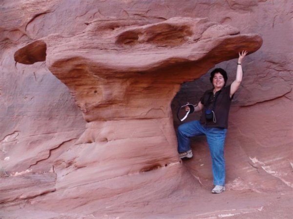 Kayla Holding Up a Sandstone Formation