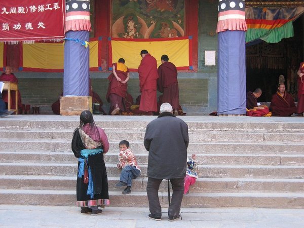 Tibetan family watching the debatting