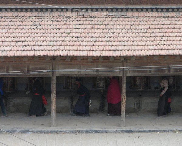 Pilgrims turning the prayer wheels