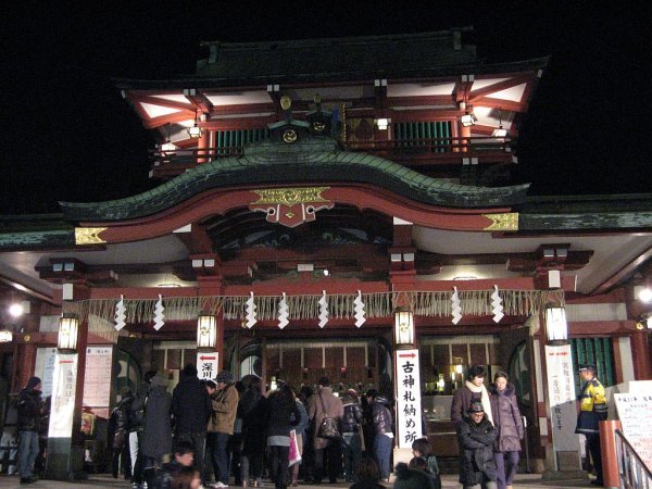 People line up in front of shrine