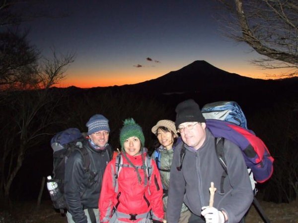 Beautiful sunset on the top with last rays behind Fuji