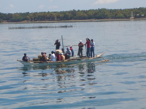 Outrigger boat to our ferry to Negros