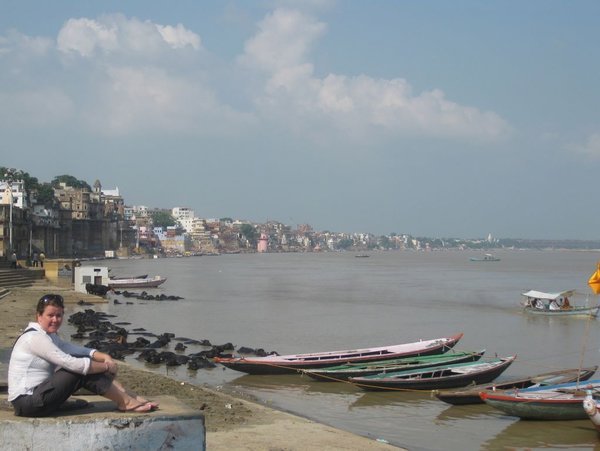 Tracy sitting on the banks of the Ganges river in Varanasi