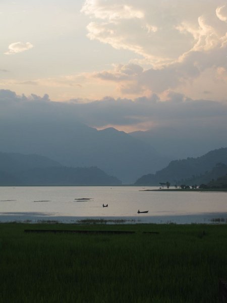 Walking around the lake in Pokhara with moody clouds