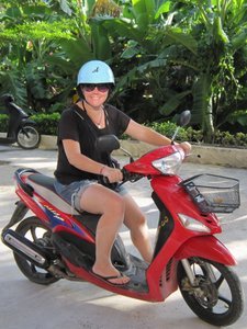 Tracy on a moped