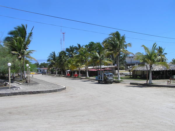 The main square and high street with restaurents of Puerto Villamil