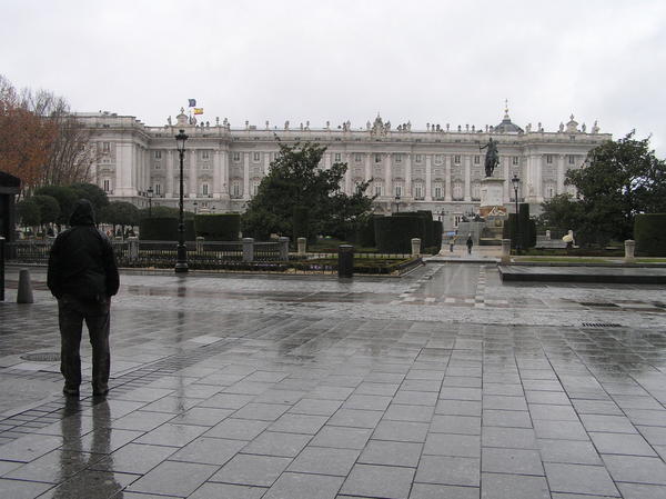 Dave standing in front of the Royal Palace of Madrid in the rain