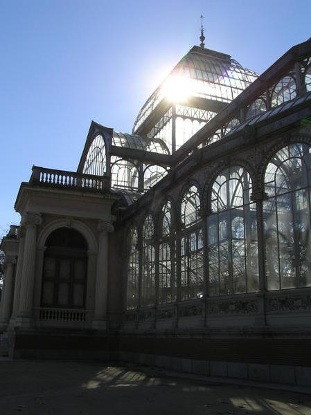  Sun shining through the crystal palace pavilion in Retiro Park