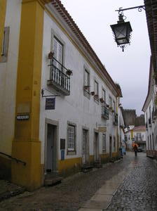 The exterior of the shop in a rainy Obidos
