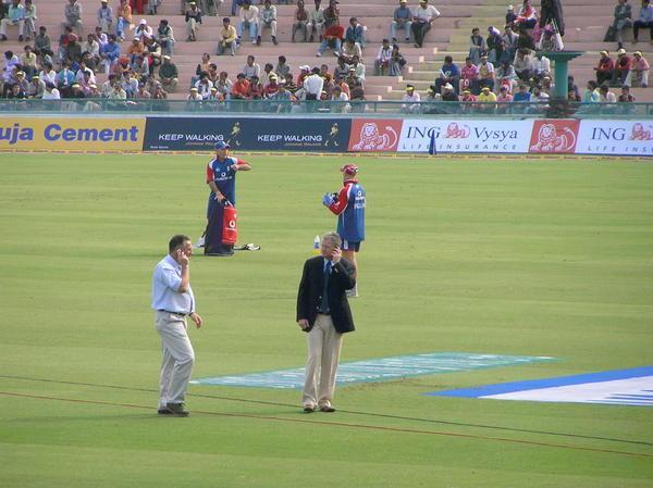 Ian Botham on mobile before the match