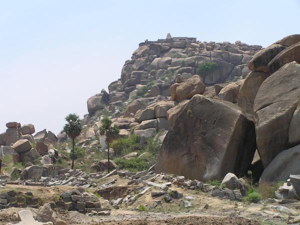 Hampi rocks, temple at the peak & palm trees