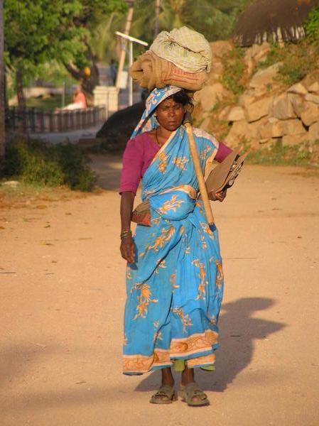 Woman walking a street in Hampi