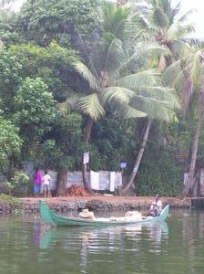 Water, canoes, palms & signs of human life - this is the Keralan backwater
