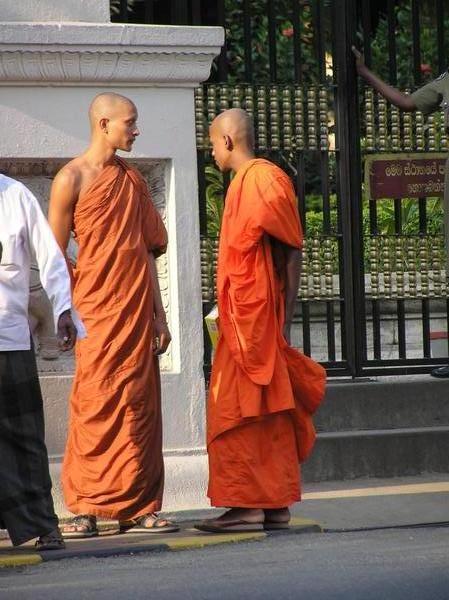 Sri Lankan Buddhist monks outside temple