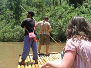 Dave having a go at poling our bamboo raft down the Mekong River