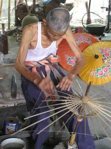 Watching traditional parasols being made