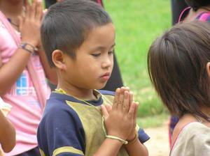 Young student saying his morning prayers
