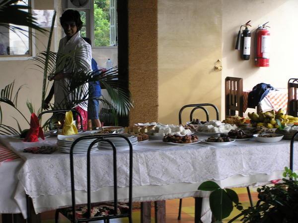 The table on New Year's morning and our hotel owner waiting for 8:24am