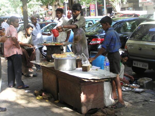 True India - hot food stalls and men loitering the day away