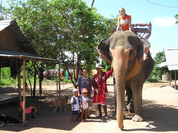 Bronia with her mahout 'Nun' and his family including the elephant