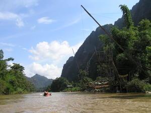 We stop at the river bar on the right & take swings into the river on the "Flying Fox" pole.