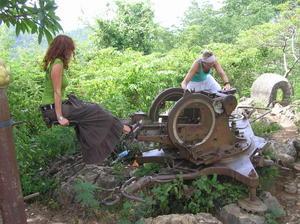 Kerry & Kristy playing on old Russian anti-aircraft machine gun beside temple on hill