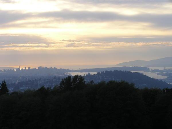 View of Vancouver downtown, Stanley Park and North Shore mountains from Burnaby Mt. at sunset