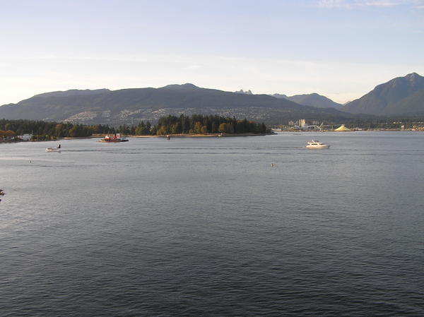 The view of Stanley Park jutting into English Bay, North Vancouver & the North Shore mountains.