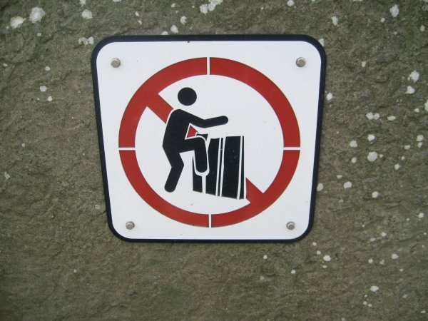 This means, "Don't kick the wall!" :)