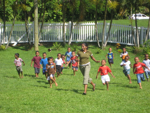 The kids chasing teacher Ester
