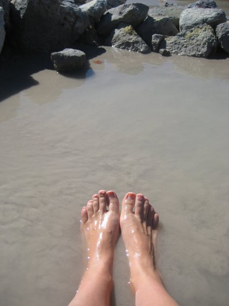My feet in the mud pool
