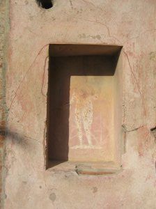 A human figure painted in the rectangular hole