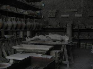 A display of Roman pottery and eerie plaster casts of buried victims