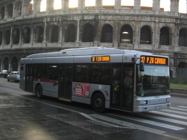 A crowded bus outside the Colosseum during morning rush-hour