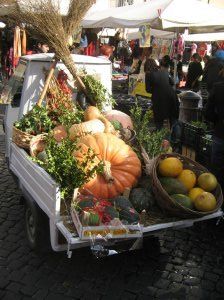 A small truck filled with vegetables