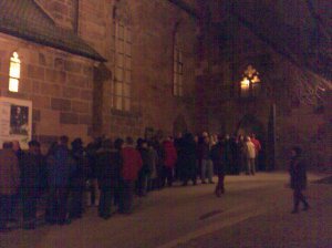 People queuing to go into the church
