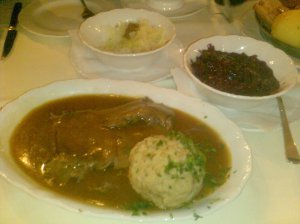 My plate of stewed beef with bread dumpling and sauerkraut