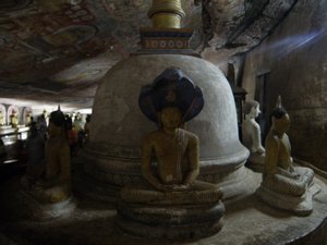 A stupa surrounded by seated Buddhas in Cave 2