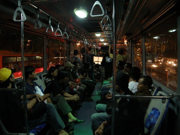 Inside a Transjakarta bus at night
