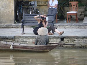 A foreign tourist taking pictures of a local