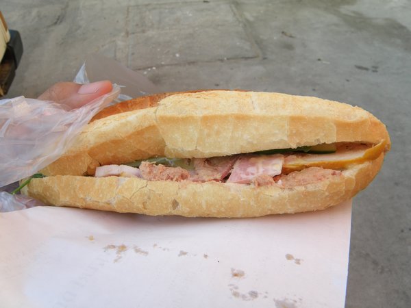 My breakfast - a crispy baguette filled with meat, onion and green pepper