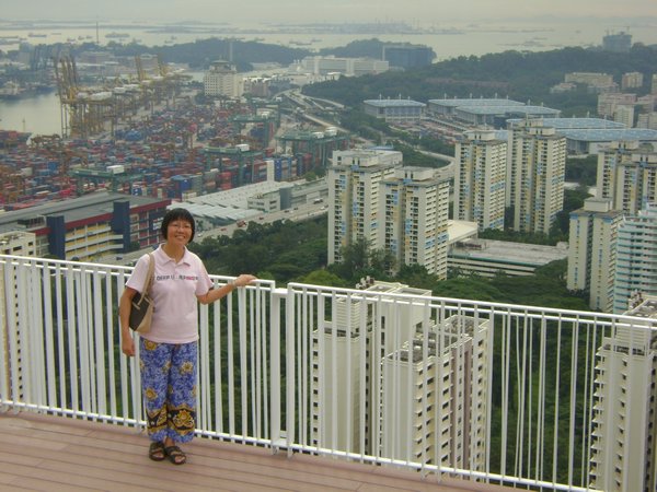 My mum with Harbourfront & Sentosa in the background