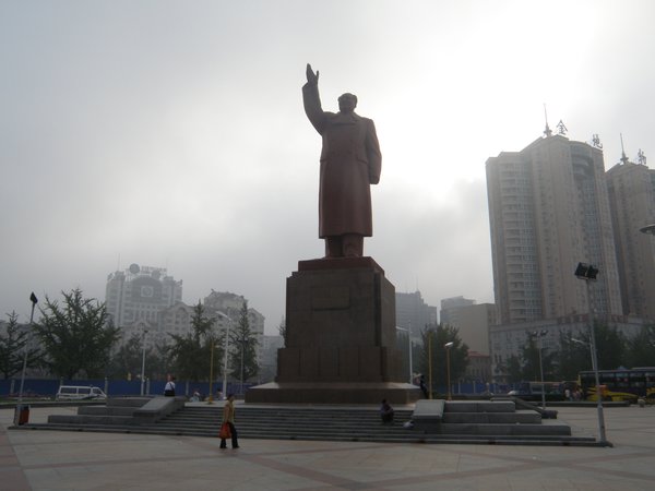 A huge statue of Chairman Mao in front of Dandong train station